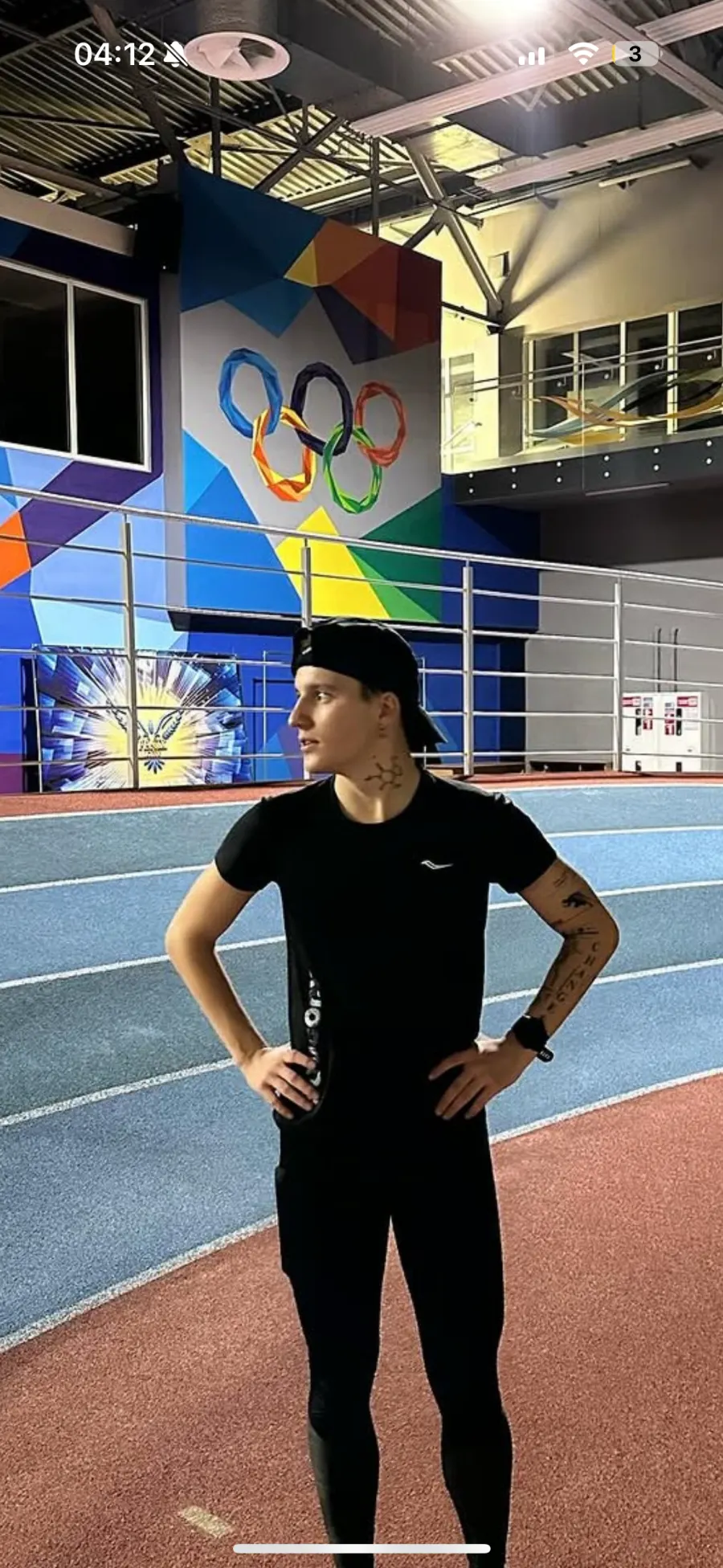 Ivan Tretiak, triathlon and running coach and massage therapist, at an indoor running track